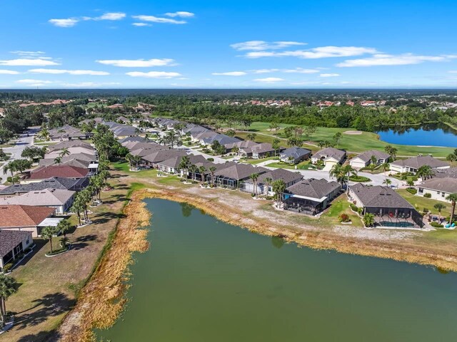 1110 Jasmine Creek Ct, Sun City Center, FL 33573 - aerial overview of property's location with nearby suburban area, a large body of water, and a golf course