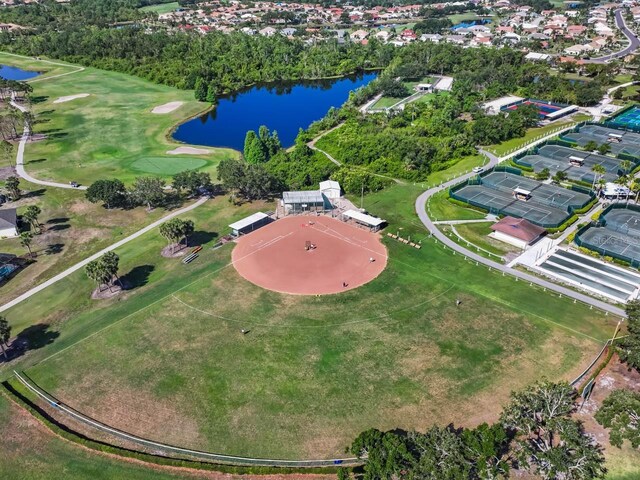1110 Jasmine Creek Ct, Sun City Center, FL 33573 - aerial view of property's location featuring a large body of water, nearby suburban area, and a golf club