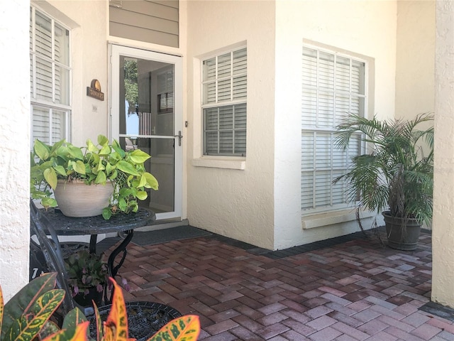 14840 Shipwatch Trce Unit 1924, Largo, FL 33774 - entrance to property featuring stucco siding and a patio area