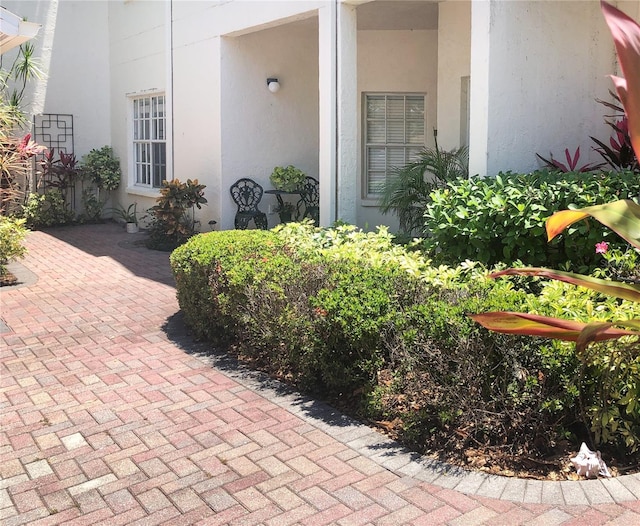14840 Shipwatch Trce Unit 1924, Largo, FL 33774 - property entrance with stucco siding