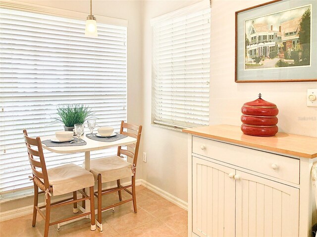 14840 Shipwatch Trce Unit 1924, Largo, FL 33774 - dining space featuring baseboards and light tile patterned flooring