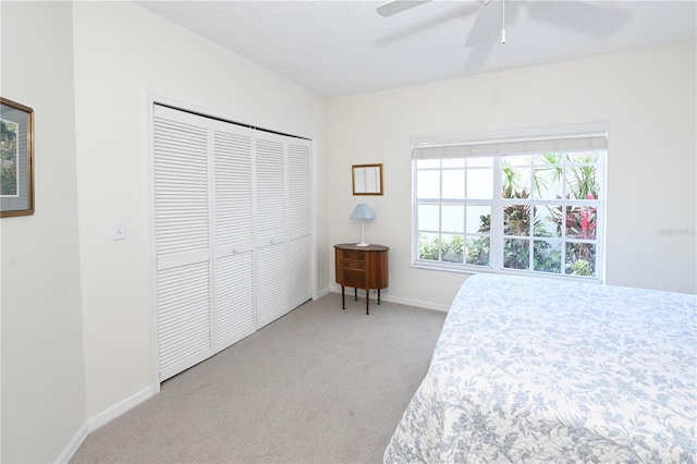 14840 Shipwatch Trce Unit 1924, Largo, FL 33774 - bedroom featuring carpet floors, a closet, baseboards, and ceiling fan
