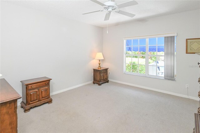 14840 Shipwatch Trce Unit 1924, Largo, FL 33774 - unfurnished room with a ceiling fan, light carpet, and baseboards