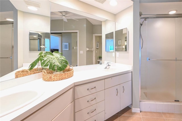 14840 Shipwatch Trce Unit 1924, Largo, FL 33774 - full bathroom with a shower stall, double vanity, tile patterned floors, and ceiling fan