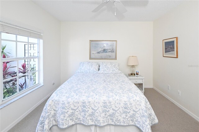 14840 Shipwatch Trce Unit 1924, Largo, FL 33774 - carpeted bedroom with baseboards and a ceiling fan