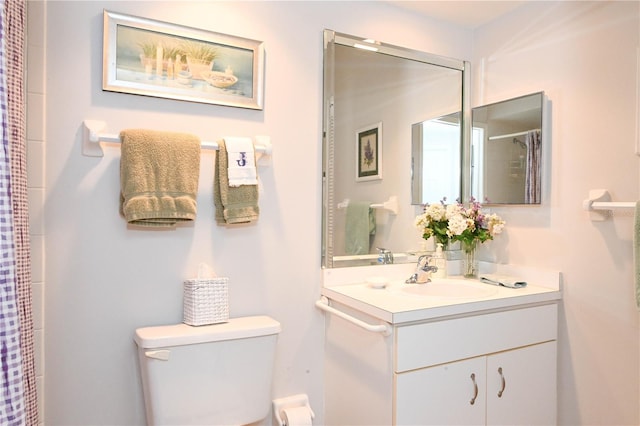 14840 Shipwatch Trce Unit 1924, Largo, FL 33774 - bathroom with vanity, toilet, and a shower with curtain
