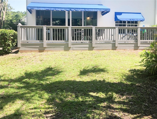14840 Shipwatch Trce Unit 1924, Largo, FL 33774 - back of house featuring a lawn and a deck