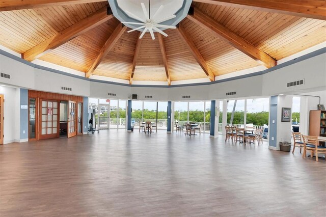 14840 Shipwatch Trce Unit 1924, Largo, FL 33774 - interior space with high vaulted ceiling and wood ceiling with exposed beams