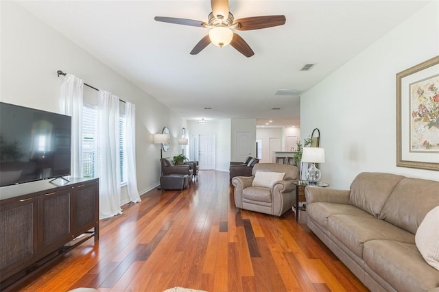 20403 Sultana Ct, Tampa, FL 33647 - living room featuring light wood finished floors and a ceiling fan