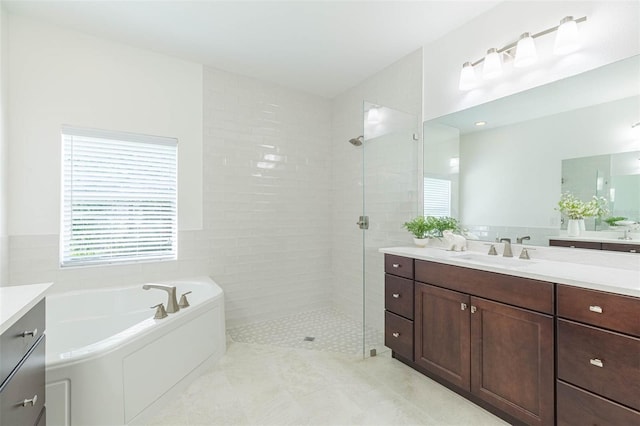 20403 Sultana Ct, Tampa, FL 33647 - full bath featuring vanity, a tile shower, a bath, tile patterned flooring, and tile walls