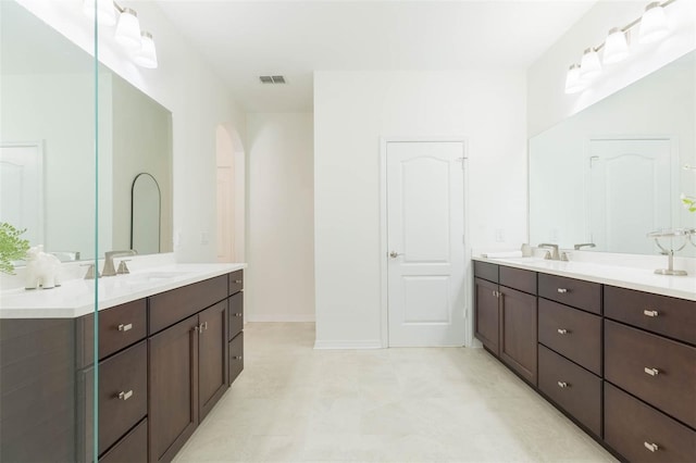 20403 Sultana Ct, Tampa, FL 33647 - full bath featuring two vanities and baseboards