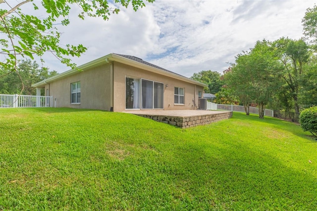 20403 Sultana Ct, Tampa, FL 33647 - rear view of house featuring stucco siding, cooling unit, and a patio