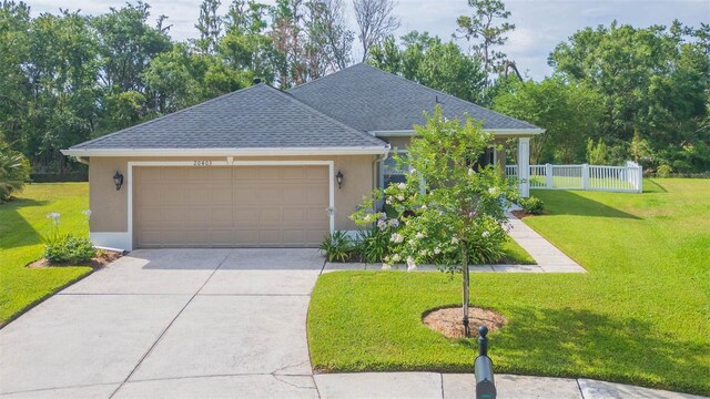20403 Sultana Ct, Tampa, FL 33647 - view of front of home featuring stucco siding, concrete driveway, a garage, and a shingled roof