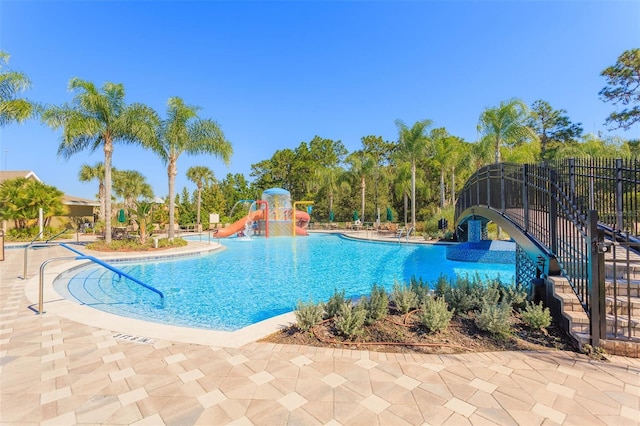 20403 Sultana Ct, Tampa, FL 33647 - community pool featuring a water slide and a patio area