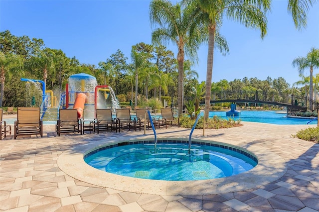 20403 Sultana Ct, Tampa, FL 33647 - community pool featuring a community hot tub and a patio area