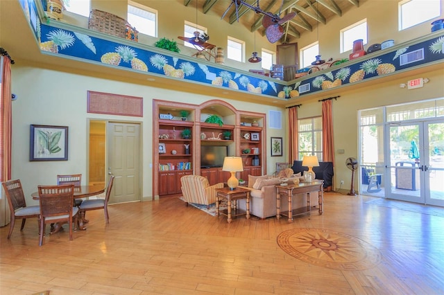 20403 Sultana Ct, Tampa, FL 33647 - sitting room with a high ceiling, hardwood / wood-style floors, french doors, beam ceiling, and baseboards