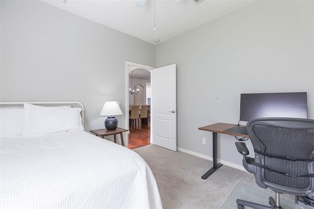 20403 Sultana Ct, Tampa, FL 33647 - carpeted bedroom with an office area, arched walkways, baseboards, and a ceiling fan