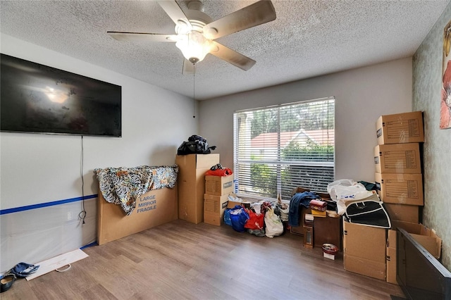 9481 Highland Oak Dr Unit 1511, Tampa, FL 33647 - misc room with a textured ceiling, wood finished floors, and a ceiling fan