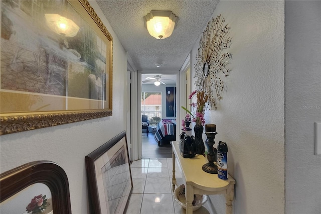9481 Highland Oak Dr Unit 1511, Tampa, FL 33647 - corridor featuring a textured ceiling and light tile patterned flooring
