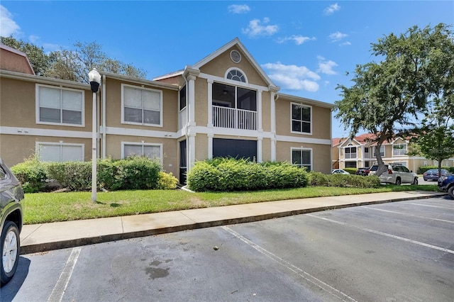 9481 Highland Oak Dr Unit 1511, Tampa, FL 33647 - view of building exterior with uncovered parking