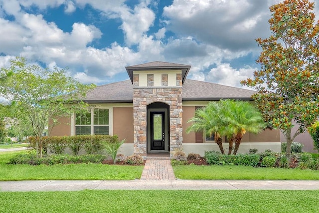 2280 Long Spur, Odessa, FL 33556 - view of front facade featuring stucco siding, stone siding, and a front yard