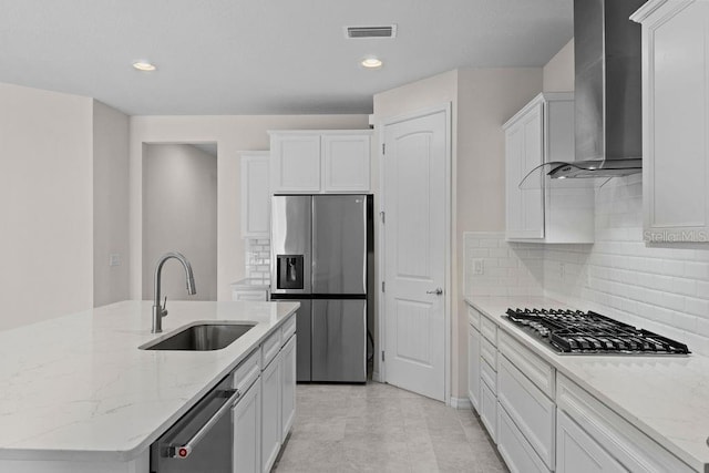 2280 Long Spur, Odessa, FL 33556 - kitchen with stainless steel appliances, wall chimney exhaust hood, a sink, white cabinetry, and recessed lighting