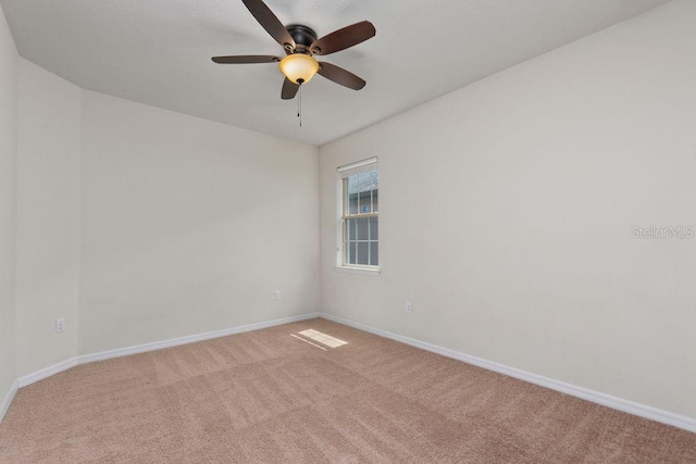 2280 Long Spur, Odessa, FL 33556 - spare room featuring light carpet, ceiling fan, and baseboards