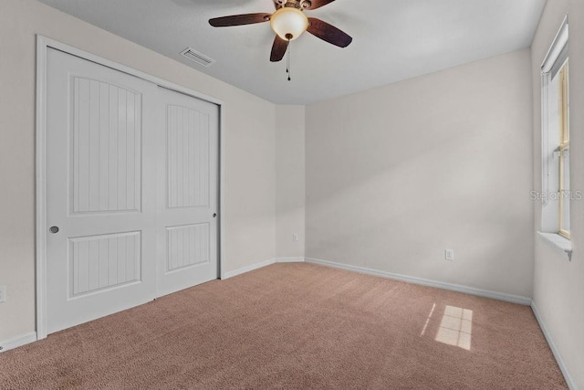 2280 Long Spur, Odessa, FL 33556 - unfurnished bedroom with carpet floors, a closet, baseboards, and ceiling fan