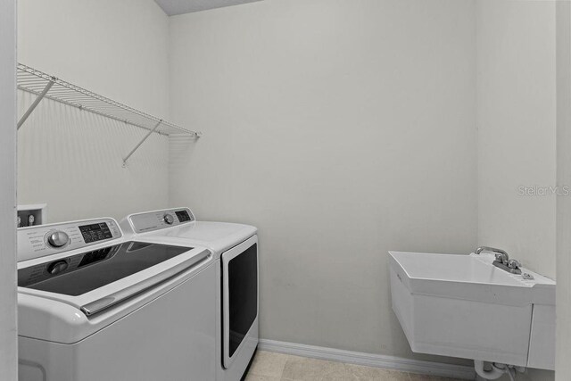 2280 Long Spur, Odessa, FL 33556 - washroom with independent washer and dryer and baseboards