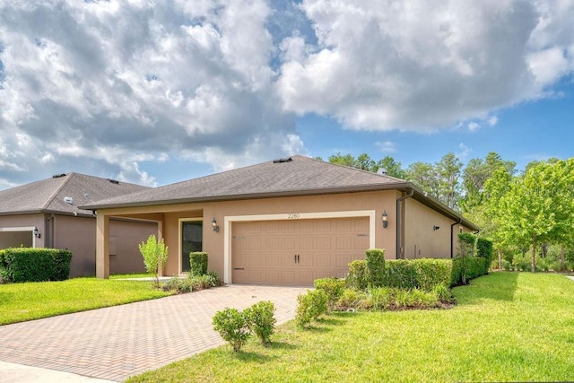 2280 Long Spur, Odessa, FL 33556 - ranch-style house featuring decorative driveway, a garage, stucco siding, and a front yard