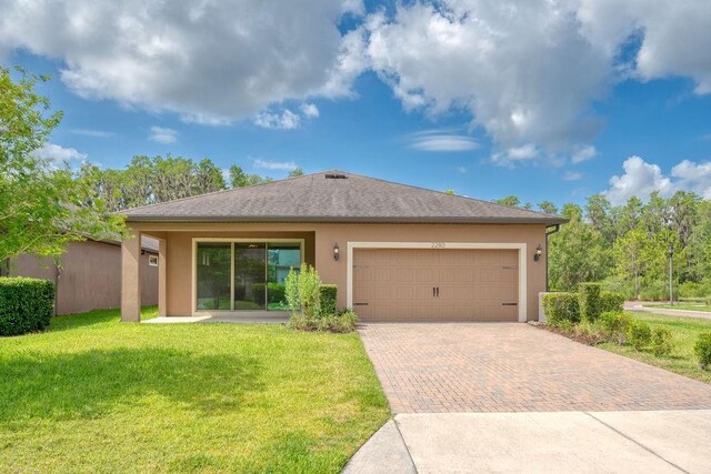 2280 Long Spur, Odessa, FL 33556 - ranch-style home with decorative driveway, a front lawn, stucco siding, and a garage