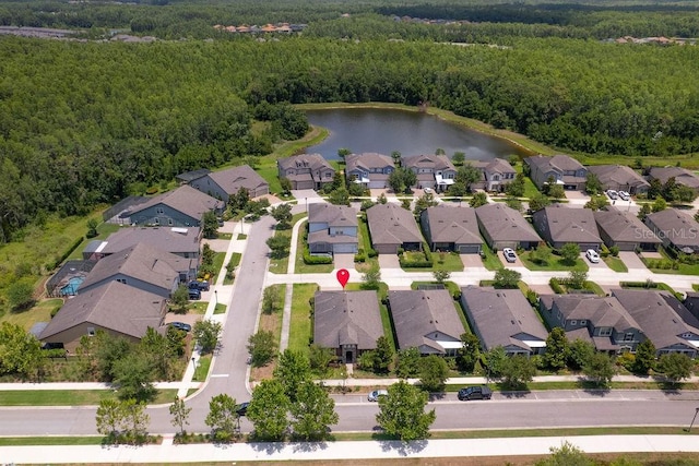 2280 Long Spur, Odessa, FL 33556 - aerial perspective of suburban area featuring a heavily wooded area and a nearby body of water