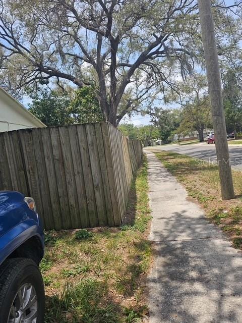 10932 N 21st St, Tampa, FL 33612 - view of asphalt road with sidewalks
