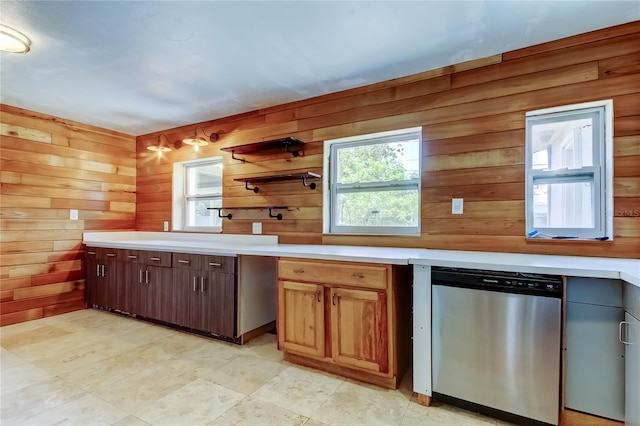 1242 Bermuda St, Clearwater, FL 33755 - kitchen with dishwasher, wooden walls, healthy amount of natural light, light countertops, and open shelves