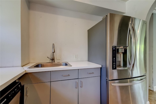 1242 Bermuda St, Clearwater, FL 33755 - kitchen featuring appliances with stainless steel finishes, a sink, gray cabinets, and light countertops