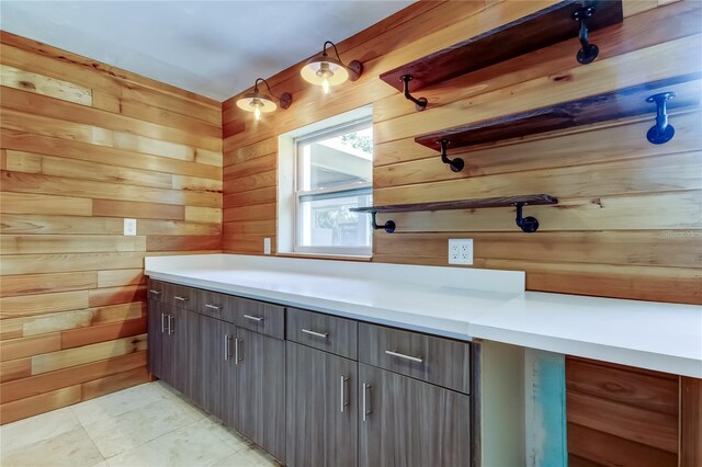 1242 Bermuda St, Clearwater, FL 33755 - bathroom featuring wood walls, tile patterned floors, and vanity