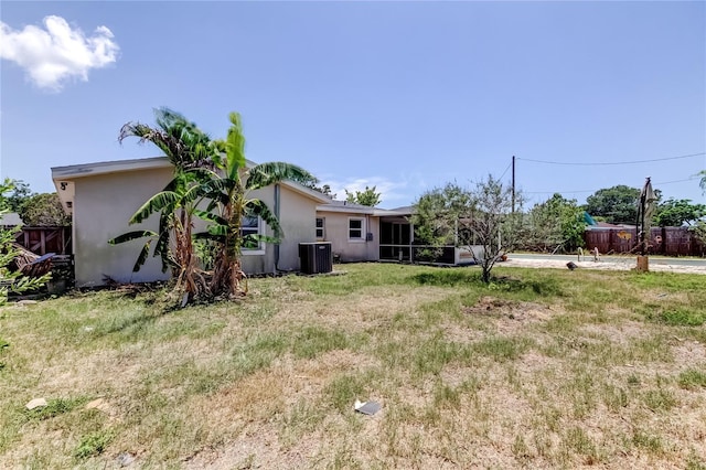 1242 Bermuda St, Clearwater, FL 33755 - view of yard featuring central AC and a sunroom