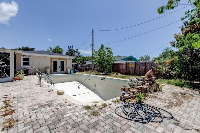 1242 Bermuda St, Clearwater, FL 33755 - view of swimming pool with french doors, a fenced backyard, and a patio