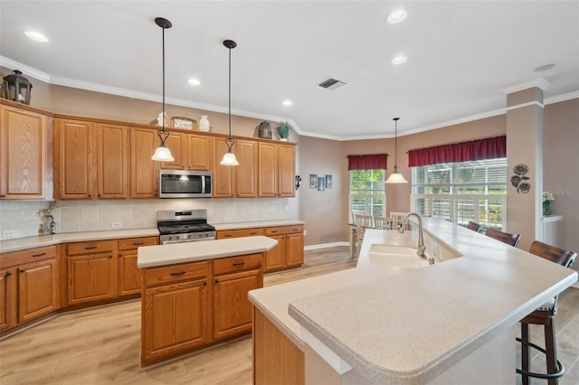 5704 Eaglemount Cir, Lithia, FL 33547 - kitchen featuring appliances with stainless steel finishes, a spacious island, a sink, decorative backsplash, and ornamental molding