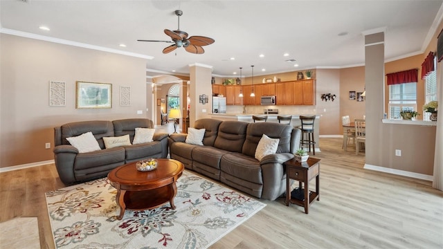 5704 Eaglemount Cir, Lithia, FL 33547 - living area featuring decorative columns, a ceiling fan, light wood-style floors, recessed lighting, and baseboards