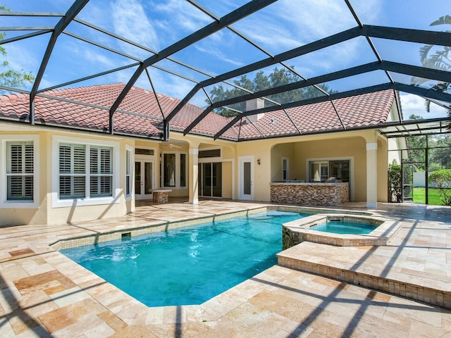 10504 Echo Lake Dr, Odessa, FL 33556 - swimming pool with an in-ground hot tub, a patio, french doors, and glass enclosure