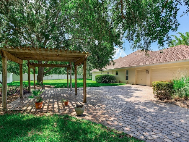 10504 Echo Lake Dr, Odessa, FL 33556 - view of yard featuring a pergola, an attached garage, and decorative driveway