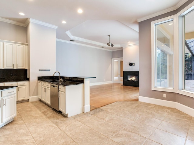 10504 Echo Lake Dr, Odessa, FL 33556 - kitchen featuring dishwasher, a peninsula, light tile patterned flooring, a sink, and crown molding