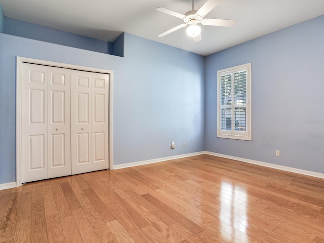 10504 Echo Lake Dr, Odessa, FL 33556 - unfurnished bedroom with light wood-style floors, baseboards, and a closet