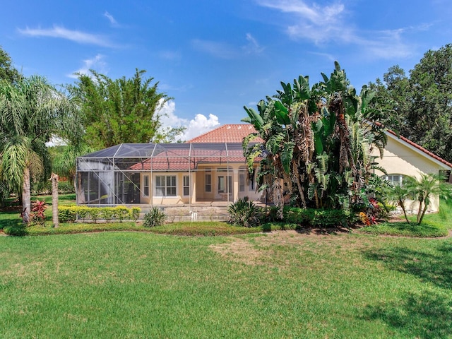 10504 Echo Lake Dr, Odessa, FL 33556 - rear view of property featuring a yard, a tile roof, and a lanai