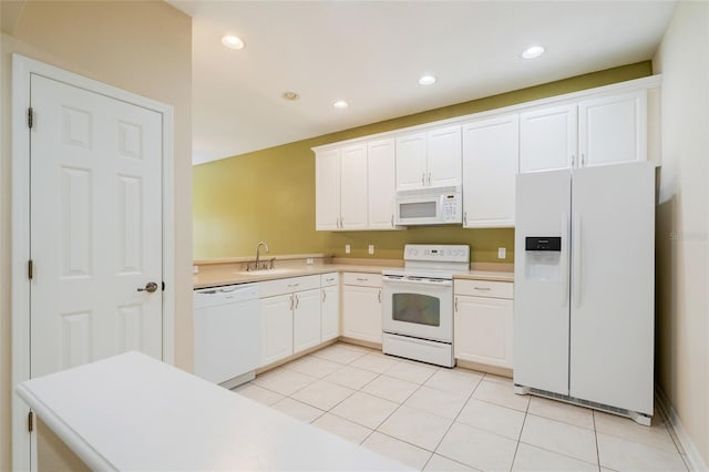 11839 Castine St, New Port Richey, FL 34654 - kitchen with white appliances, a sink, light countertops, light tile patterned floors, and recessed lighting