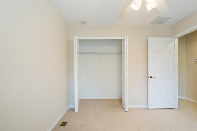 11839 Castine St, New Port Richey, FL 34654 - unfurnished bedroom with a closet, light colored carpet, baseboards, and ceiling fan