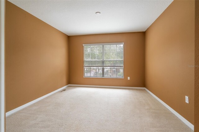 11839 Castine St, New Port Richey, FL 34654 - unfurnished room with carpet floors and baseboards