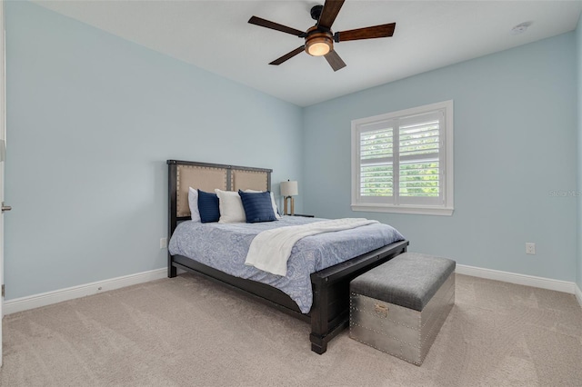 152 Glenn Moor Cir, Dunedin, FL 34698 - carpeted bedroom with baseboards and ceiling fan