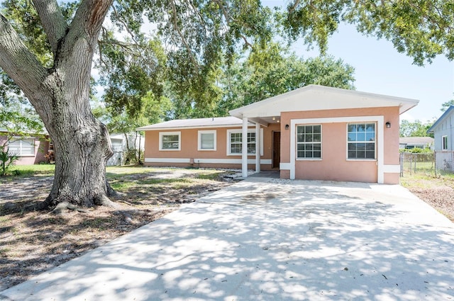 2121 23rd St SW, Largo, FL 33774 - view of front of house featuring concrete driveway and stucco siding
